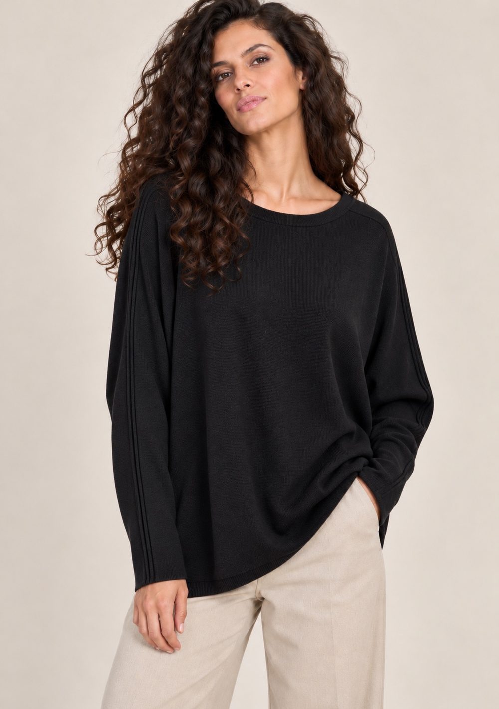 Maglia bottoni dietro in colore nero